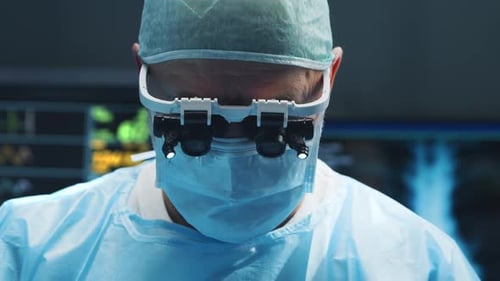 Multiracial Team of Professional Medical Surgeons Performs the Surgical Operation in a Modern