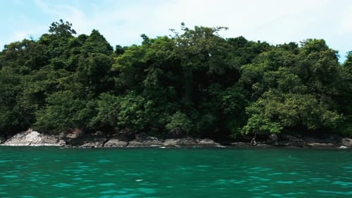 Drone Shot of a Tropical Island with Breathtaking Lush Rainforest