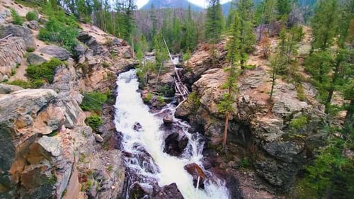 Water Flowing Through Rocky Mountain River In Colorado At Daytime. - static