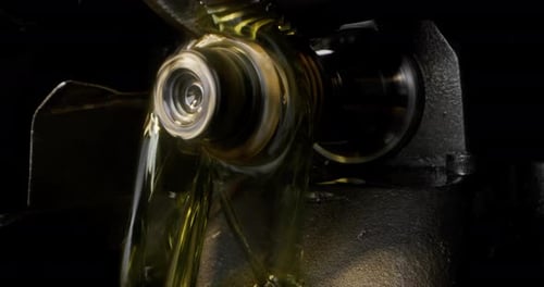 Close Up of Industrial Gears Rotating With Oil