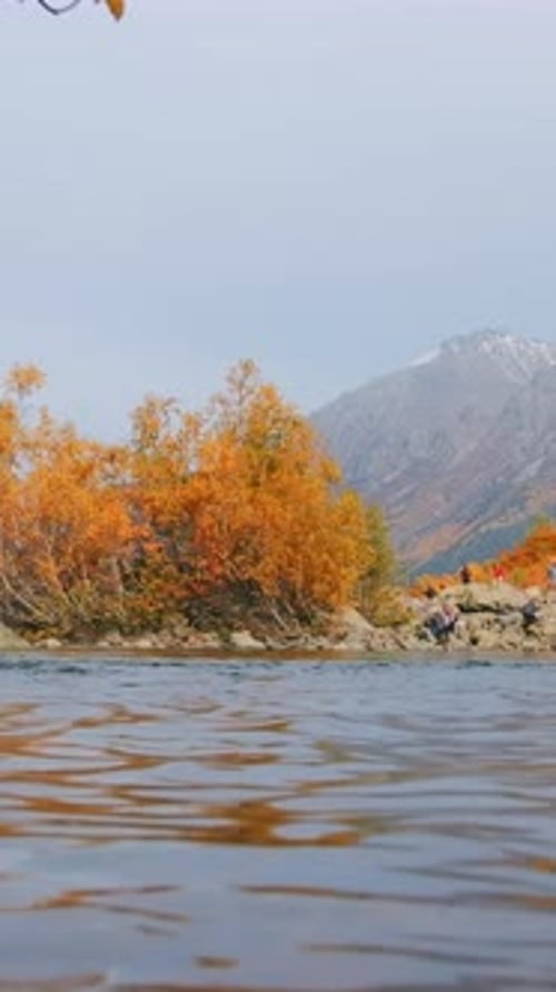 Surface of Water with View of Autumn Trees and Vacationing Tourists in Mountains Creative Autumn