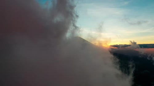 Dark Atmospheric Cloudscape With Faint Sunlight Fading Behind The Horizon Line