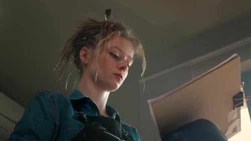 A Talented Girl Draws a Sketch of a Picture on Paper with a Pencil Creates Contemporary Art in a