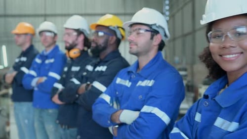 Diverse Team of Engineers Standing in Manufacturing Workplace