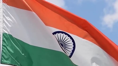 The flag of India waves in the wind in slow motion.