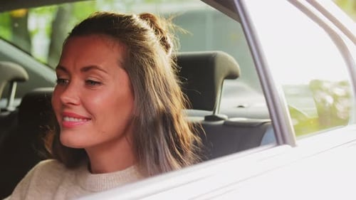 Transport, Vehicle And Technology Concept - Happy Smiling Woman In Car Using Tablet Pc Computer