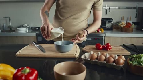 Person Preparing Food in Kitchen With Fresh Ingredients