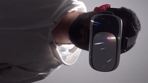 Man Wearing VR Headset with Abstract Lights