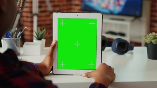 Office Worker Vertically Holding Wireless Gadget with Greenscreen Display