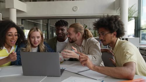 Excited Students Celebrating Success Looking at Laptop Screen