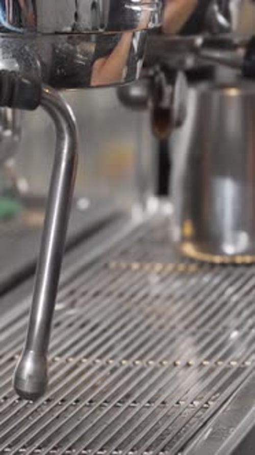 Coffee Being Prepared at Coffee Machine