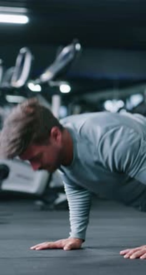 Fitness, push up or man in gym with exercise, power or cardio strength in endurance training