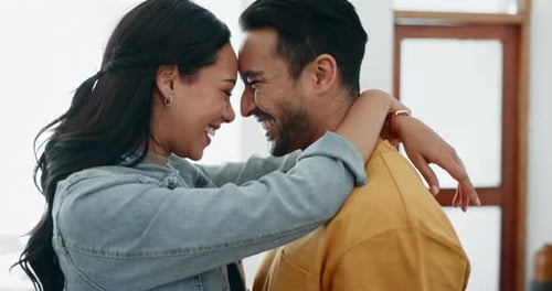 Loving Couple Embracing in Bright Home Interior