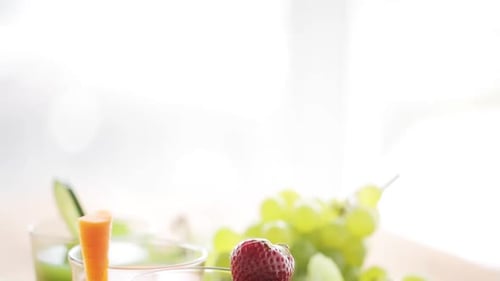 Fresh colorful fruit and vegetable smoothies dolly shot