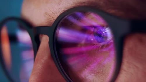 Close Up of Glasses Reflecting Computer Light