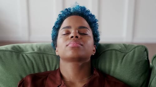 Woman with Blue Hair Napping on Couch