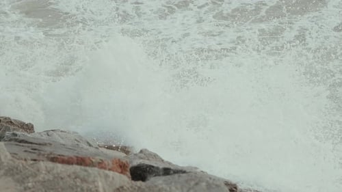 Rough Sea Waves Crashing on Rocky Shoreline