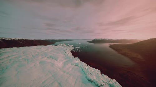 Tranquil Morning Shot of Icy Shoreline at Dawn with Reflections