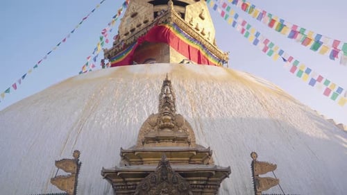 View of The Beautiful Swayambhunath Stupa Or Monkey temple With Colorful Prayer Flags With Blue Sky