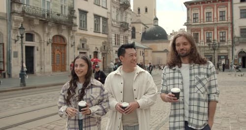 Friends Drinking Takeaway Coffee in the Old City