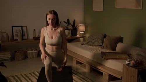 Young Woman Doing Yoga in Her Home