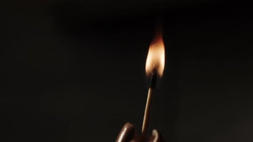 Burning Matchstick Ignites and Smokes