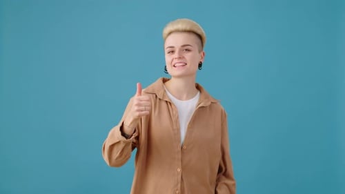 Blond Young Adult Giving Double Thumbs Up