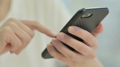Close up of Female Hand Using Smartphone