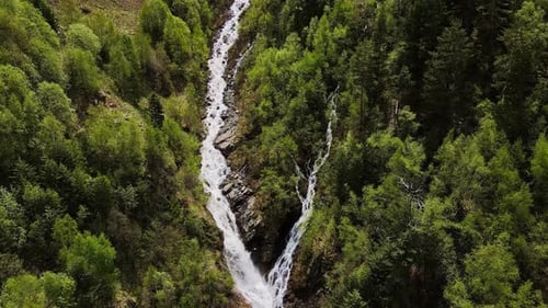 Aerial Drone Footage of Waterfall and Green Spring Mountain Scenery
