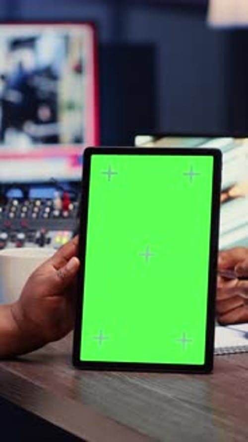 Vertical Video Green Screen Tablet Hold By Woman on Podcast Discussing with Guest During Marathon