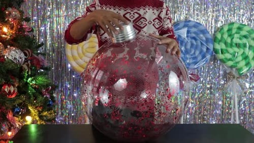 Large handmade Christmas decoration ball. DIY crafts in workshop