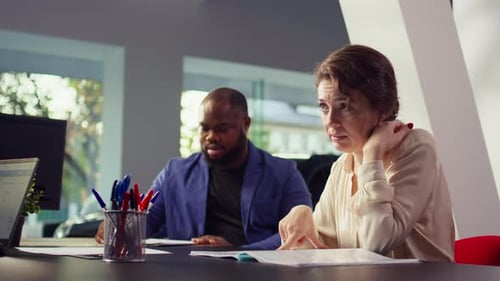 Office Meeting with Man and Woman Discussing Ideas