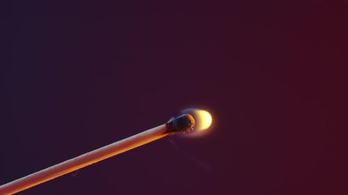 White Smoke From an Extinguished Match on Dark Background