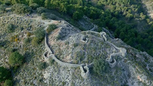 Trench in the mountain. Aerial view of walled area in rocky mountain.