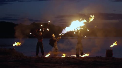 Pyrotechnics And Fire Show On River Coast In Darkness Amazing Flames And Torches Slow Motion