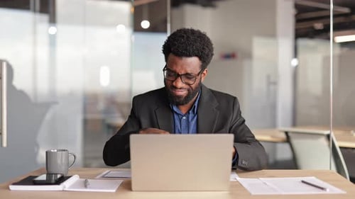 Frustrated Businessman Working on Laptop in Office Stress and Annoyance at Work