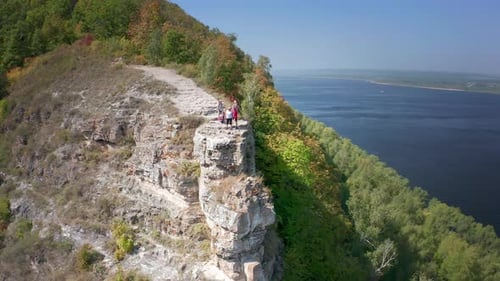Hikers on the rock. Group of hikers stand on top of the rock ( Camel Rock) and enjoy the view. Zhigu