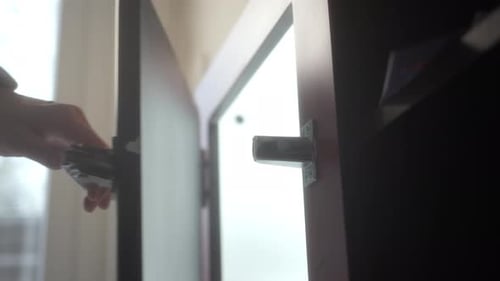 Close Up View of Male Tattooed Hand Close Sideboard Door