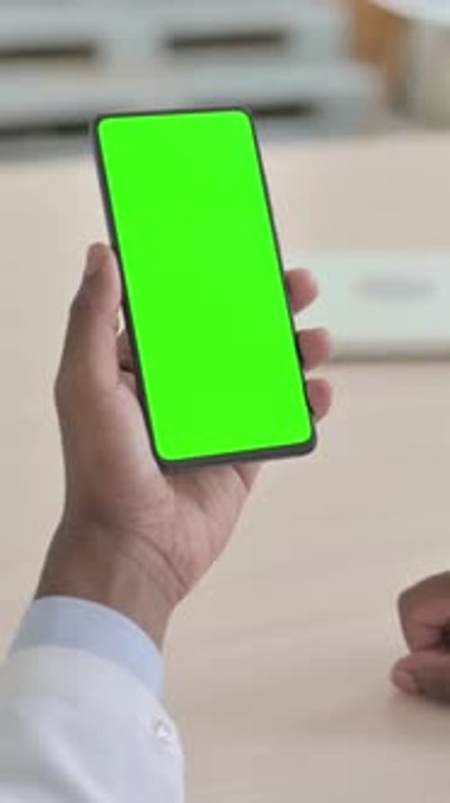 Close Up of African Doctor Using Smartphone with Green Screen, Vertical Video