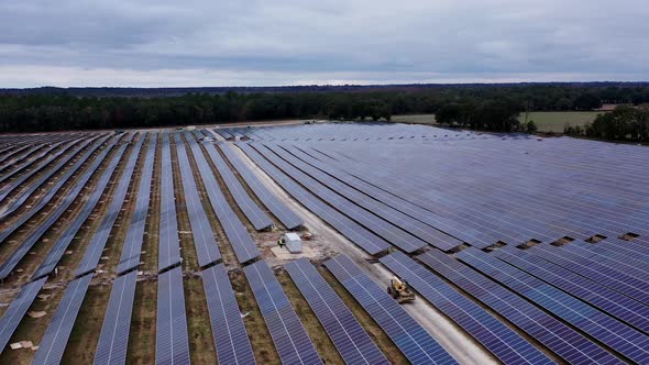 fly drone over solar panel field on cloudy day, Industrial Stock ...