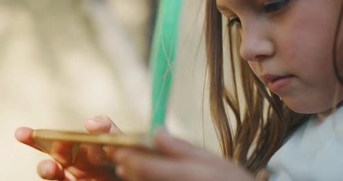 Girl Uses Smartphone Device Close Up