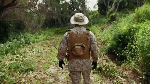 Alone Soldier Following The Dirt Road