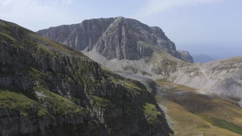 An aerial view though some high mountain peaks, in the mountain of Tymfi in Greece