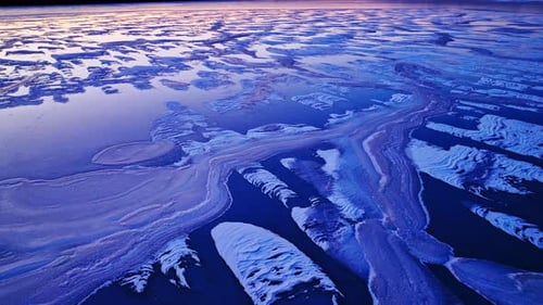 Colorful ice on top of river on cold winter day