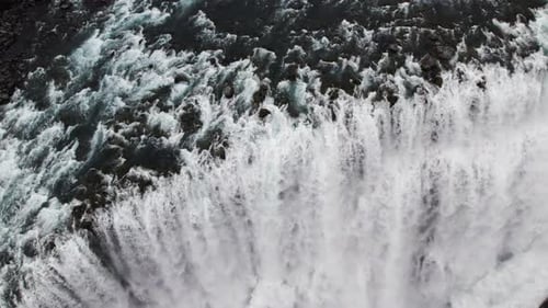 Dramatic Aerial View of Powerful Waterfall