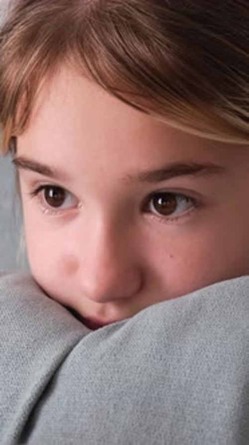 Childs Face Creatively Interacting with Tech Logo in Video