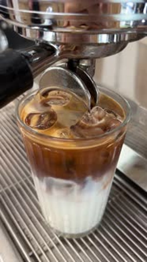 Iced Latte Coffee Drink Poured From Espresso Machine