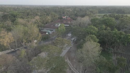 Aerial View of Building Amongst Lush Green Trees