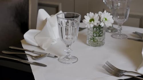 Elegant Table Setting with Glassware and Flowers