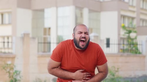 Bald indian Man Stomachache